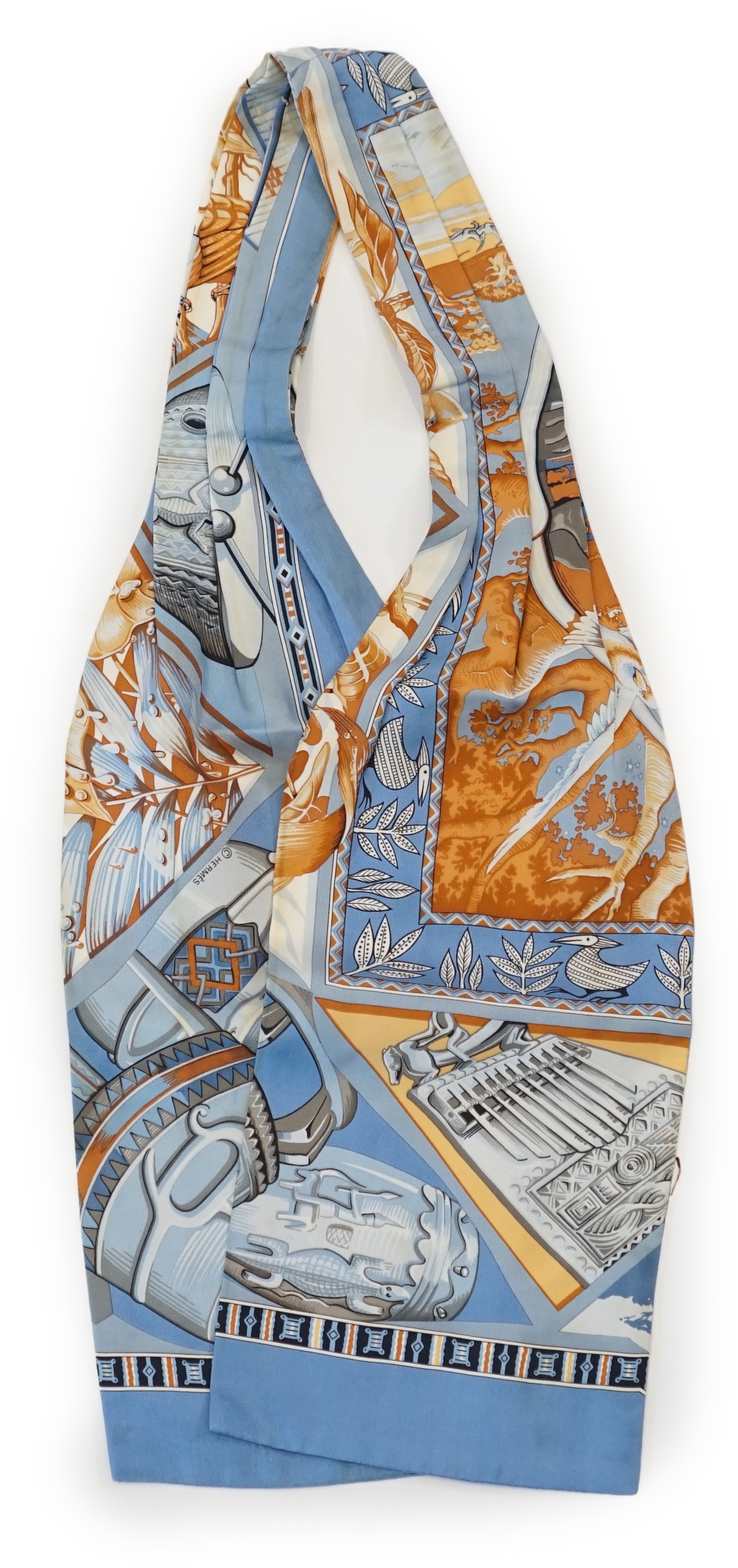 A Hermès silk cravat in ethnographic pattern, length 127cm x 18cm
